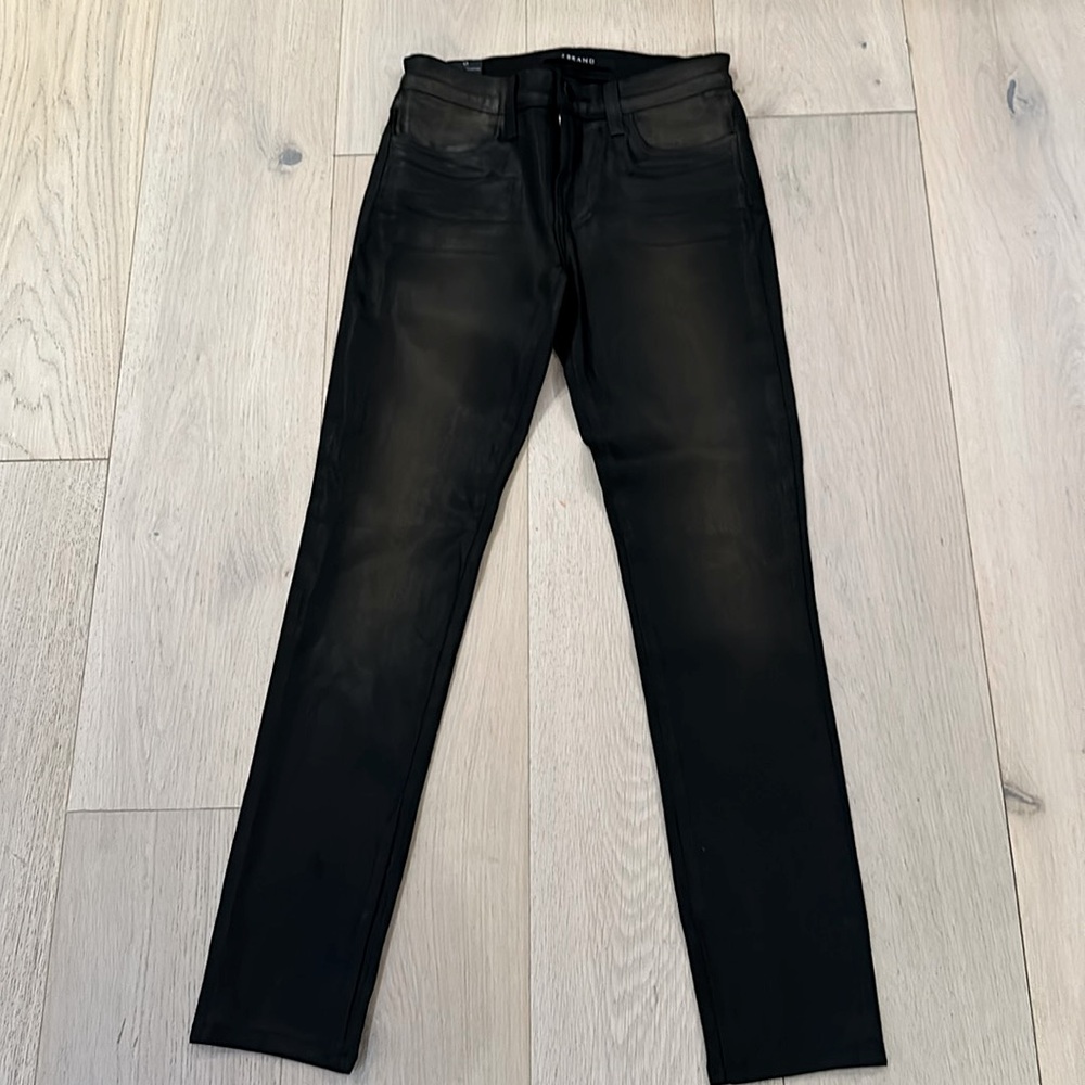 J Brand wax coated noir (black) jeans. 
Mid rise, skinny fit.
Size 25